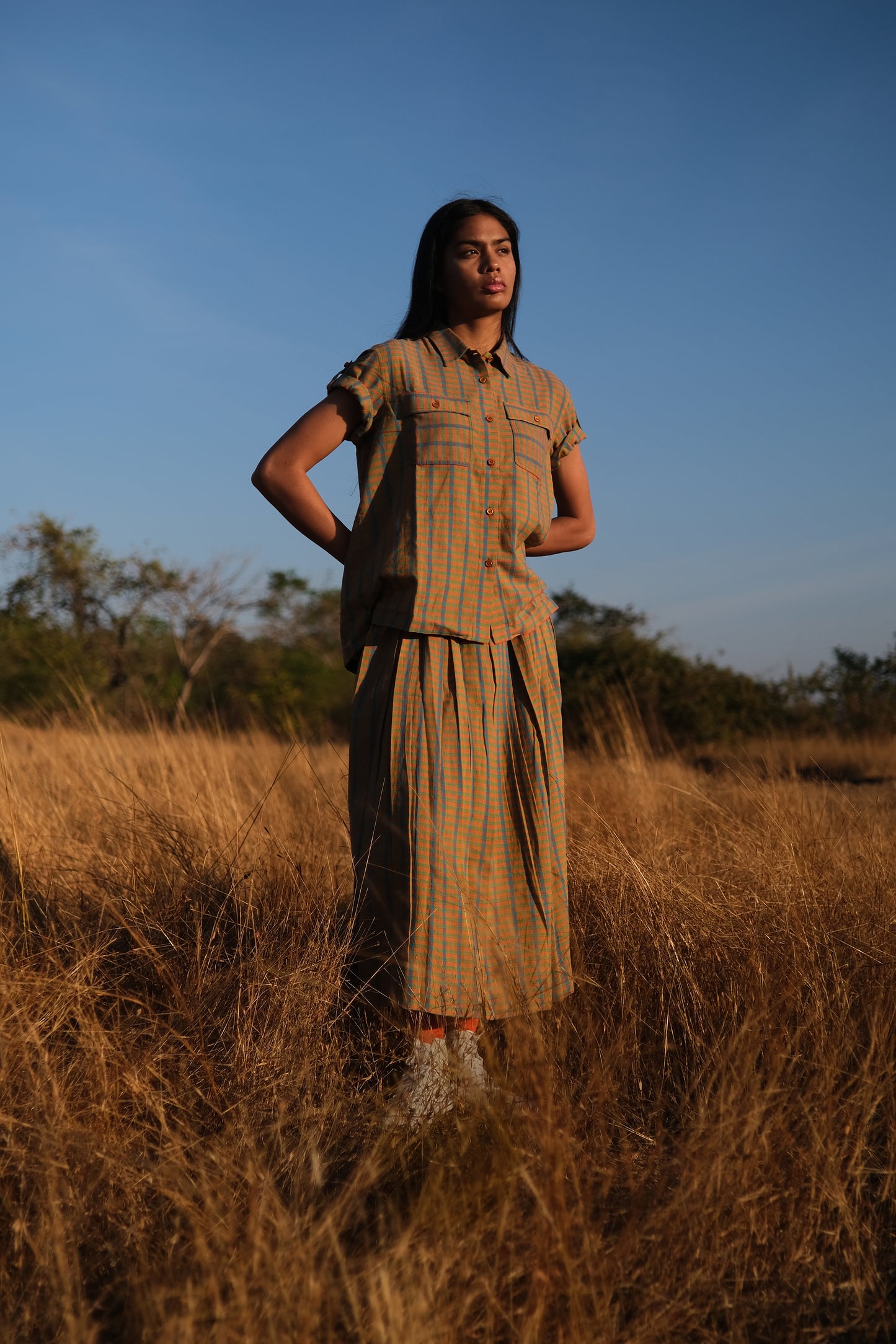 Plains Design - Twin shirt in orange. Orange and blue checkered shirt with short sleeves and a straight relaxed fit. Ethically handmade cotton.
